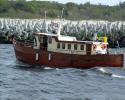 Wooden motor yacht for sport fishing and recreation